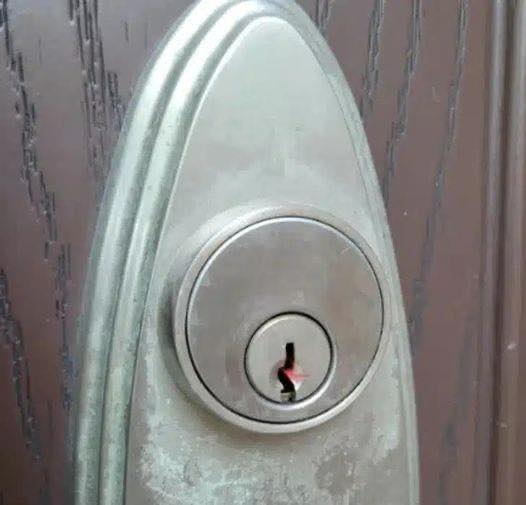 I found red wax in the keyhole on my front door. Any idea ?